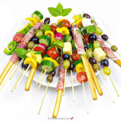 Picnic Skewers served on a big white plate and looking extra bright and delicious