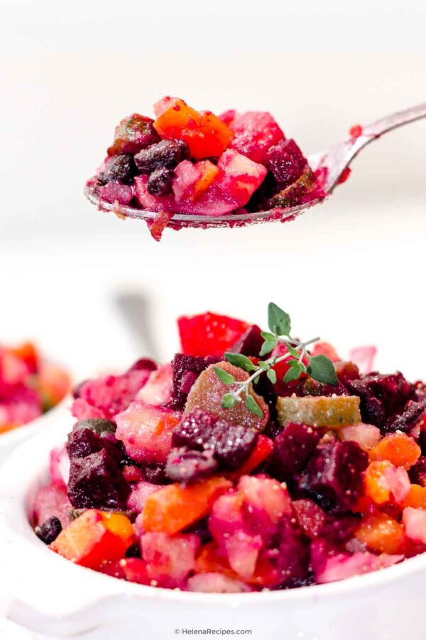 A spoonful of the vegan Beetroot Carrot Potato Salad or Vinehret Recipe in the air