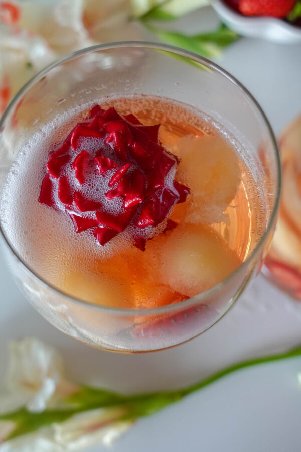 A glass of the delicious Sparkling Strawberry Melon Sangria served on a special occasion
