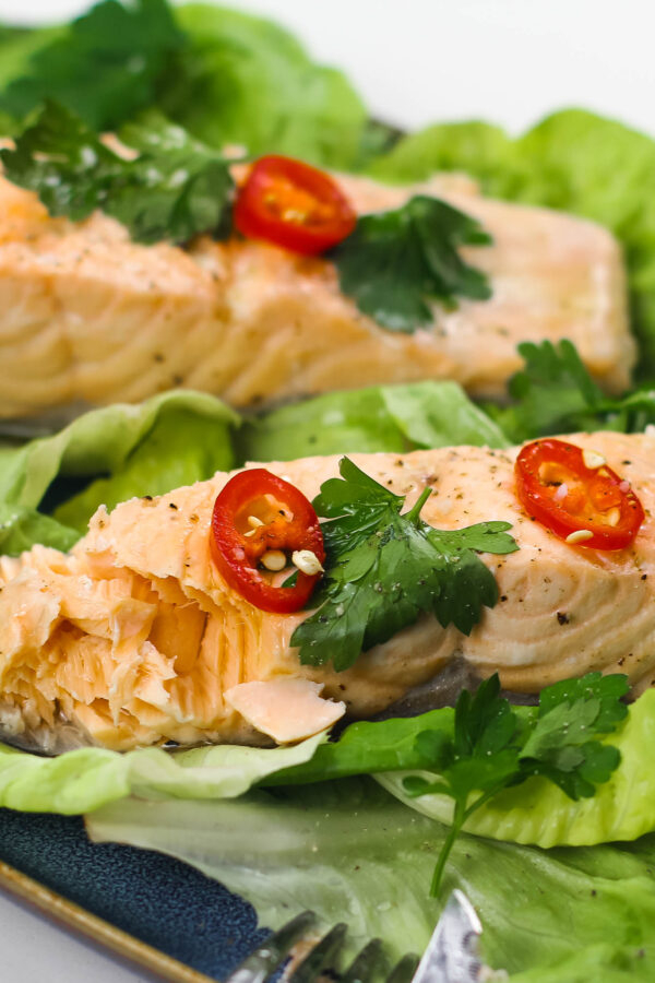 Poached Salmon on a plate with salad.