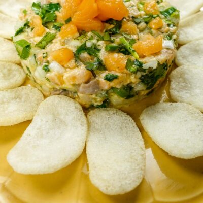 Mediterranean Salmon Tartare with chips on a plate.