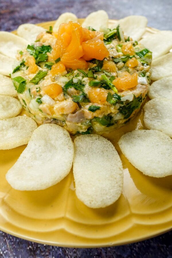 Mediterranean Salmon Tartare with chips on a plate.