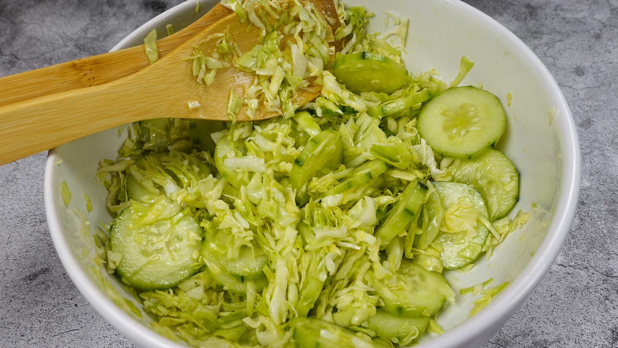 Mediterranean Cabbage Cucumber Salad in a big white bowl.